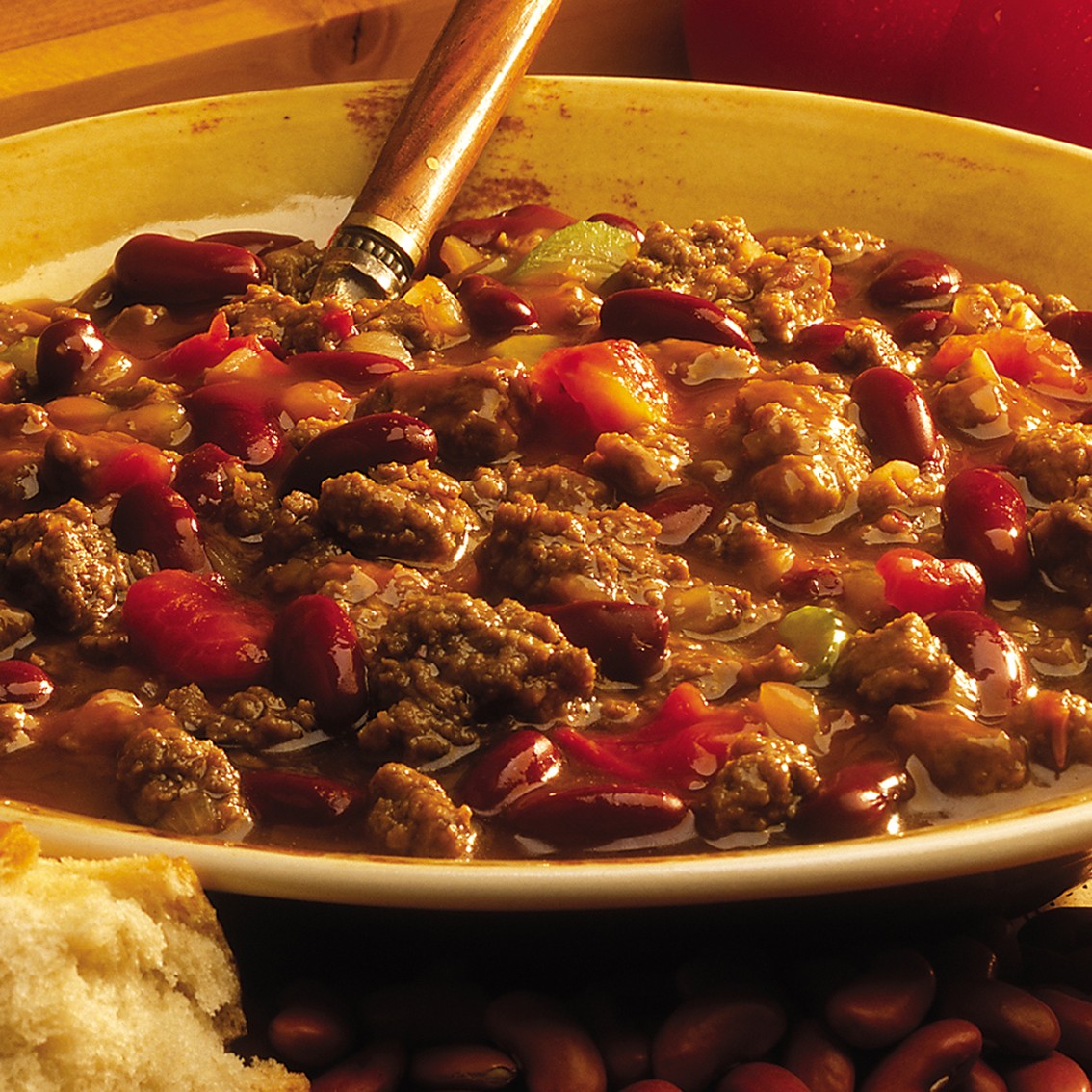Bowl of foodservice Whitey's Frozen Chili Manufacturers Beef Chili in a restaurant setting